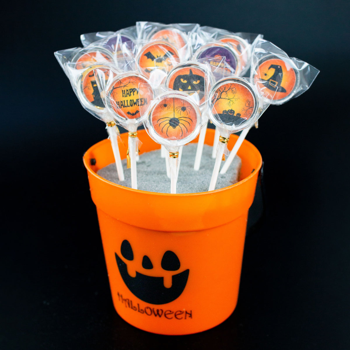 Halloween Lollis orange schwarzes Design in orangenem Halloween Eimer