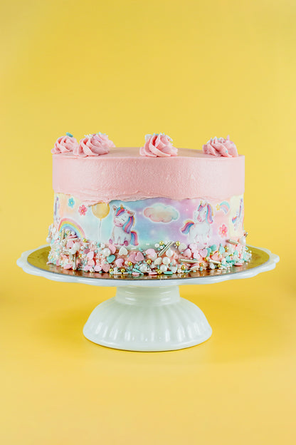 Tortenband Einhorn um geschmückte Torte auf Tortenständer