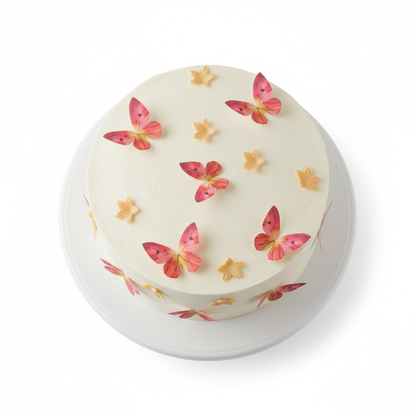 essbare Oblatendekoration Schmetterlinge und Blumen Orange Pink auf  einer hellen Torte dekoriert