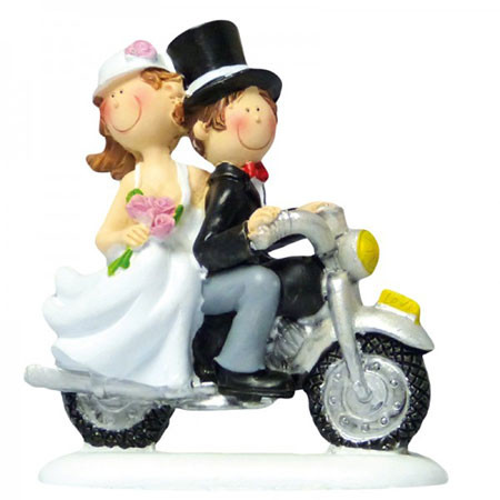 Bride and groom on a motorbike
